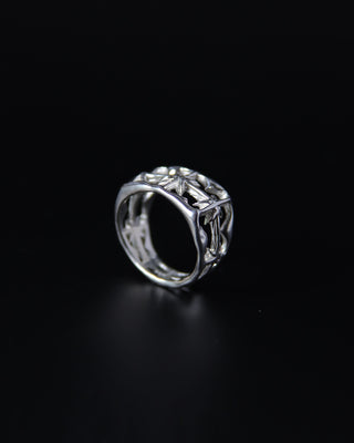 Soft signet Sterling Silver ring with intricate star design on a black background